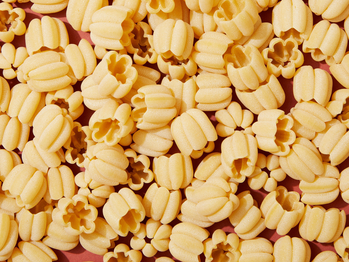 A close-up of dry pasta noodles.