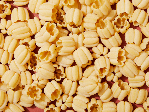 A close-up of dry pasta noodles.