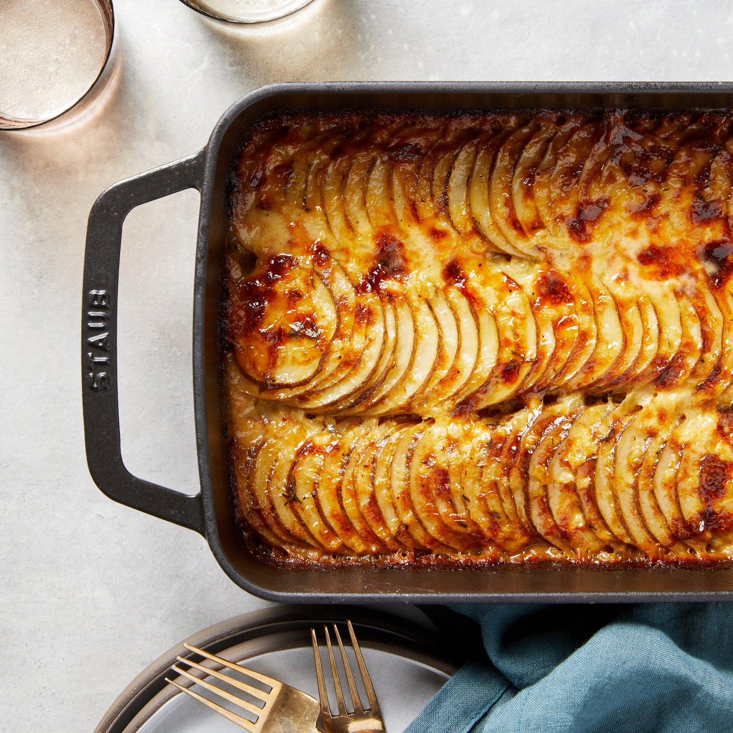A baking dish of black garlic potatoes au gratin. 