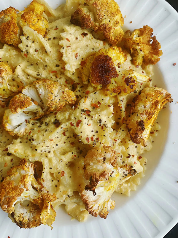 Plate of charred cauliflower and pasta.