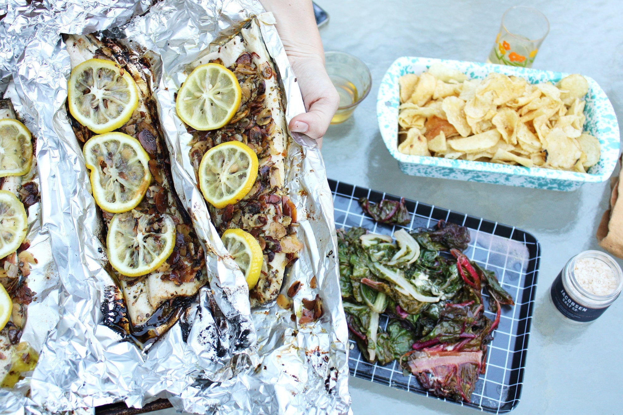 Tin foil with trout and lemons.