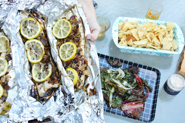 Tin foil with trout and lemons.