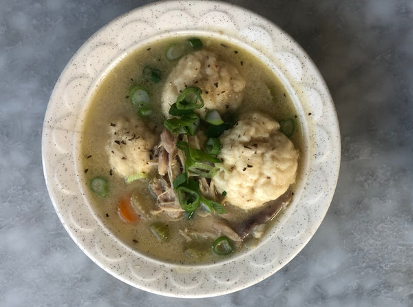 A bowl of chicken and dumpling soup.
