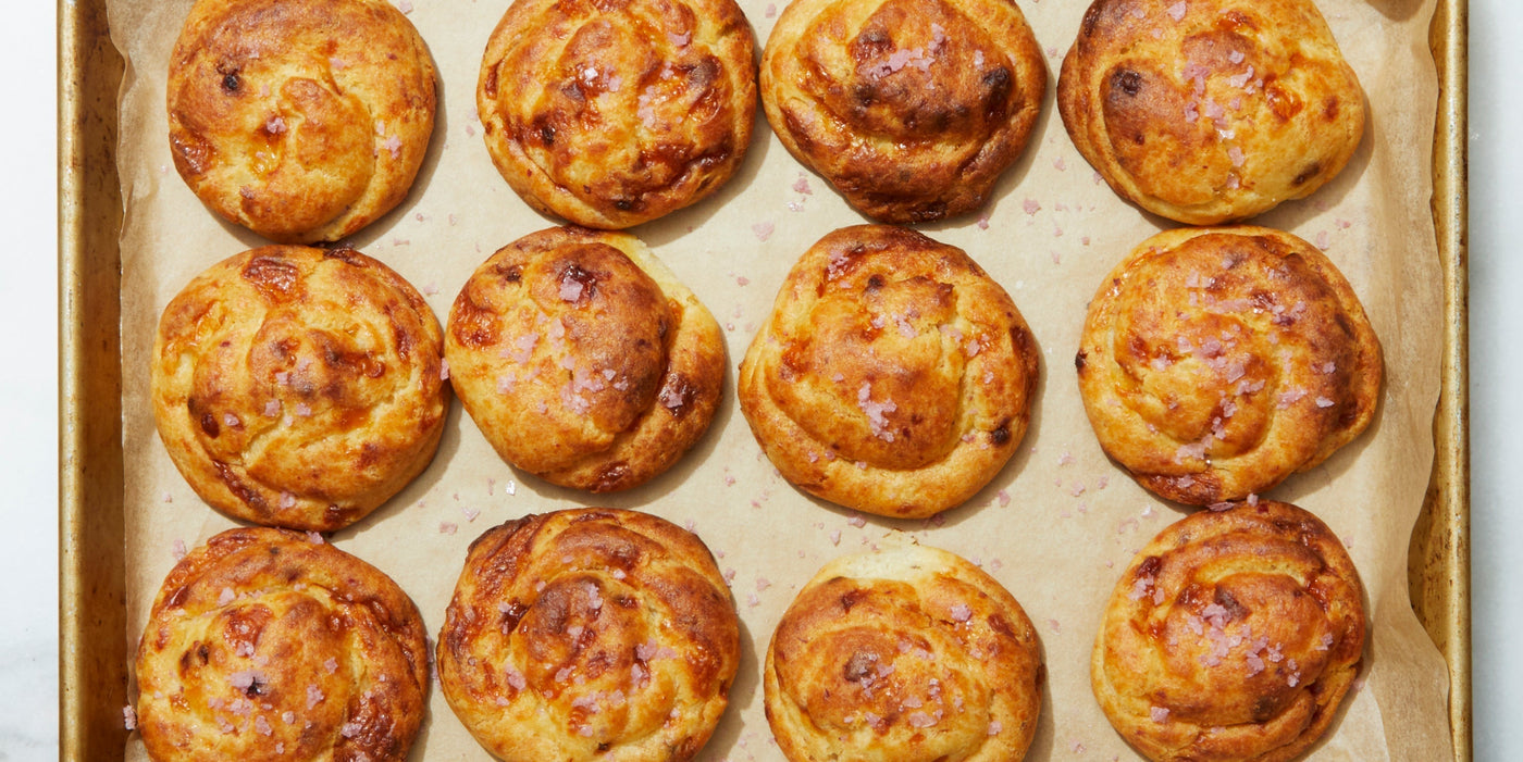 A tray of twelve gougère pastries.