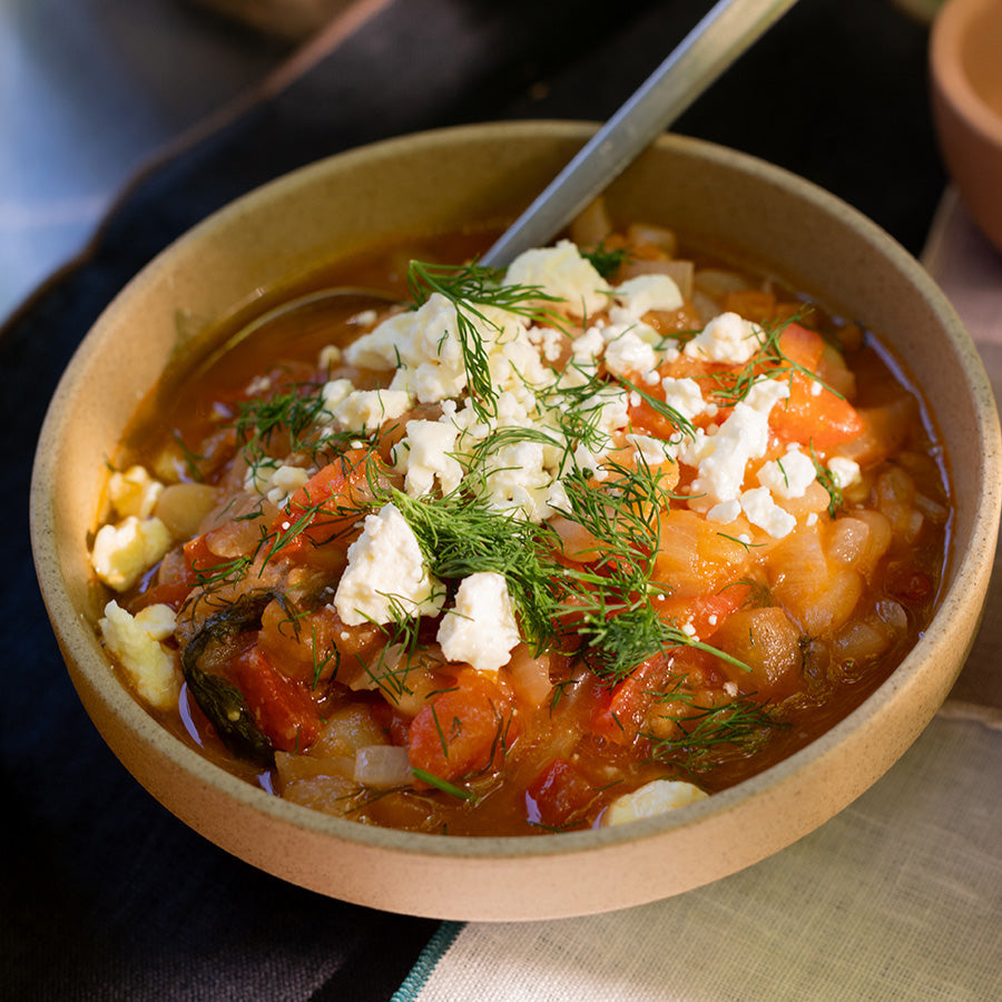 Tomato and bean soup topped with feta cheese and dill.