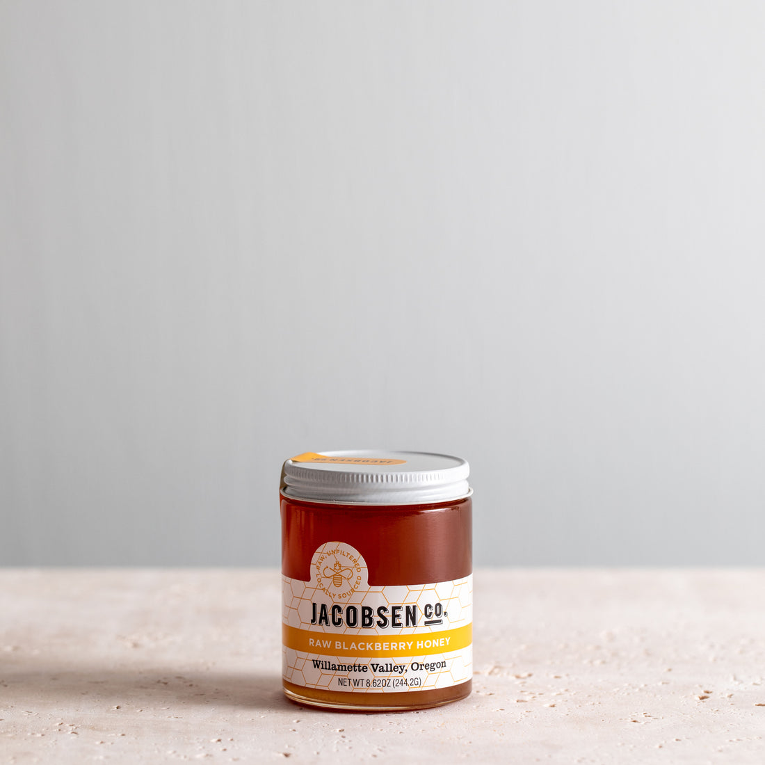 8.62 ounce jar of Jacobsnen Raw Blackberry Honey
