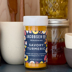 Jar of Jacobsen Savory Turmeric Seasoning on pantry shelf.